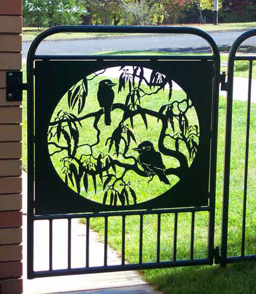 custom made metal art gate featuring 2 kookaburras perched on gum tree branches
