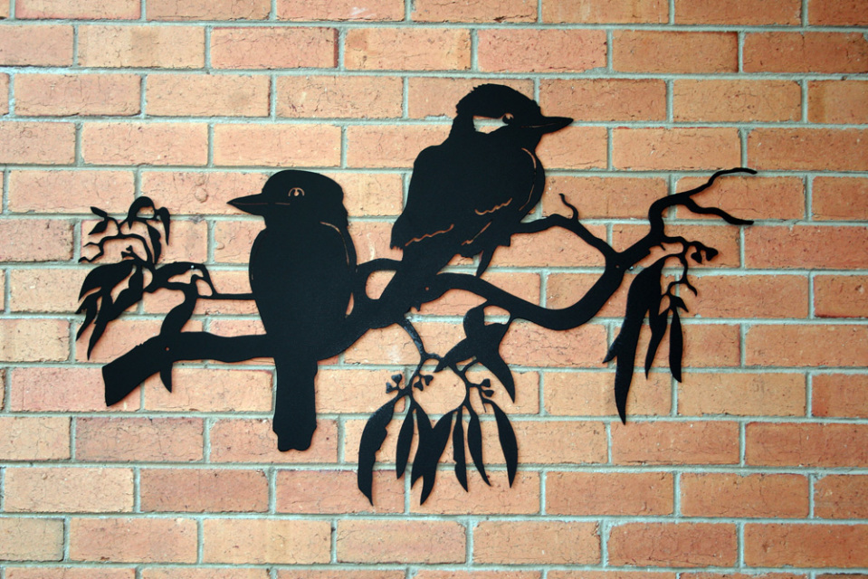 Metal wall art design of 2 Australian Kookaburra birds perched on a branch.
