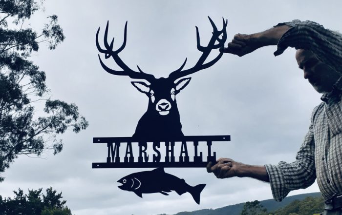 Custom made metal wall art house name sign incorporating red deer stag and fish