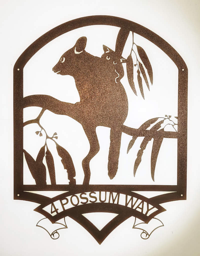 Personalised metal art house sign featuring a possum, gum leaves and the address.