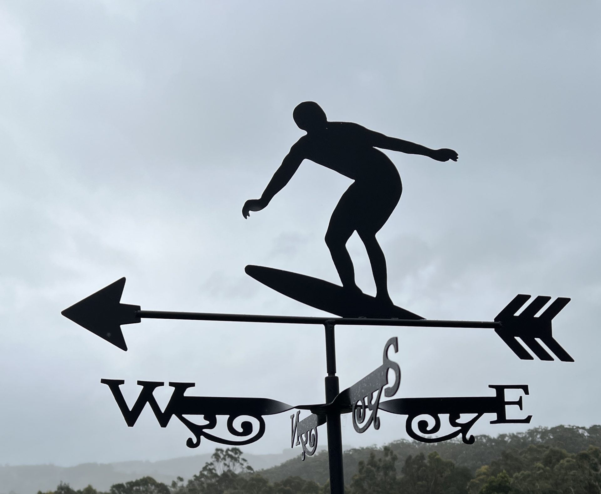 Australian Surfer Weathervane Weathervane featuring a surfer balancing on his board.