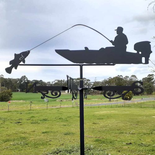 Fisherman landing a barramundi